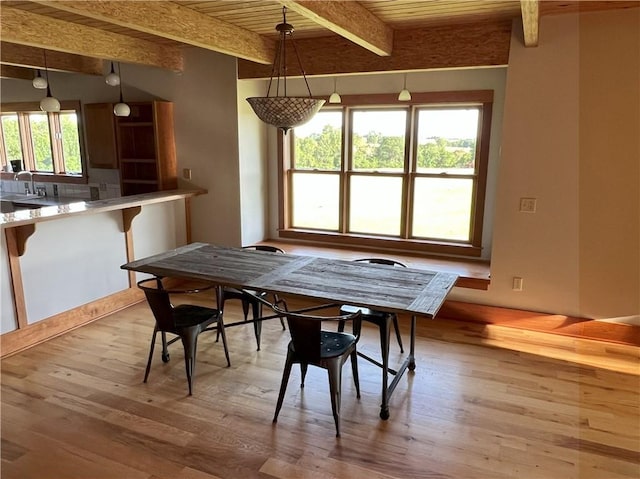 11320 Reno Rd, Oskaloosa, KS 66066 - dining area with light wood-style floors and a wooden ceiling with exposed beams
