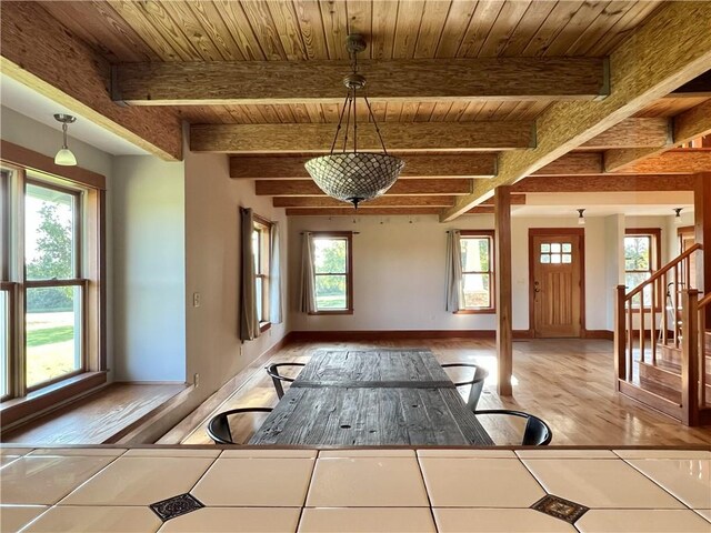 11320 Reno Rd, Oskaloosa, KS 66066 - entrance foyer with healthy amount of natural light, a wood ceiling with exposed beams, light wood-style flooring, and stairway