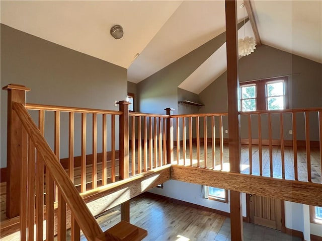 11320 Reno Rd, Oskaloosa, KS 66066 - staircase with wood finished floors and lofted ceiling