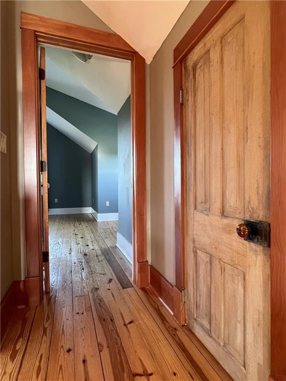 11320 Reno Rd, Oskaloosa, KS 66066 - hall with lofted ceiling and wood-type flooring