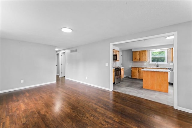 26 Misty Springs Cir, Platte City, MO 64079 - unfurnished living room featuring dark wood-style floors