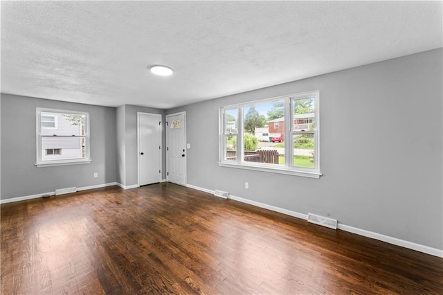 26 Misty Springs Cir, Platte City, MO 64079 - unfurnished room with dark wood-type flooring and a textured ceiling
