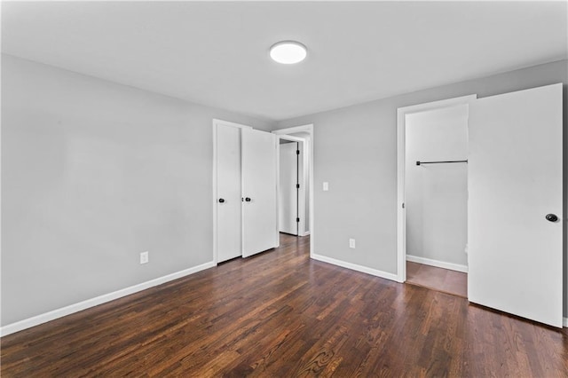 26 Misty Springs Cir, Platte City, MO 64079 - unfurnished bedroom featuring wood finished floors and baseboards
