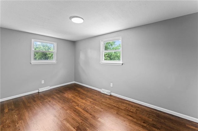 26 Misty Springs Cir, Platte City, MO 64079 - unfurnished room featuring baseboards and dark wood-style flooring