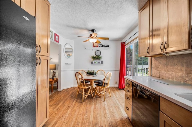300 NE R D Mize Rd, Blue Springs, MO 64014 - dining room with light wood-style floors, ceiling fan, and a textured ceiling