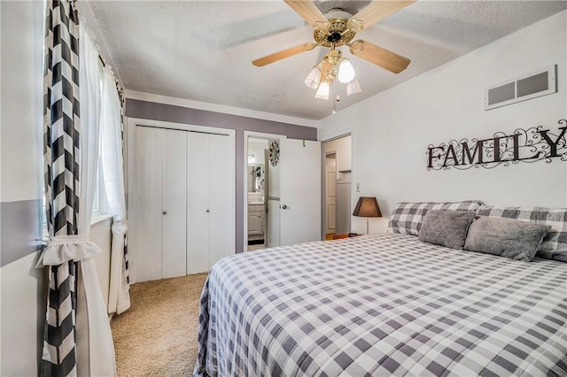 300 NE R D Mize Rd, Blue Springs, MO 64014 - carpeted bedroom with a closet, a textured ceiling, ceiling fan, and ensuite bath
