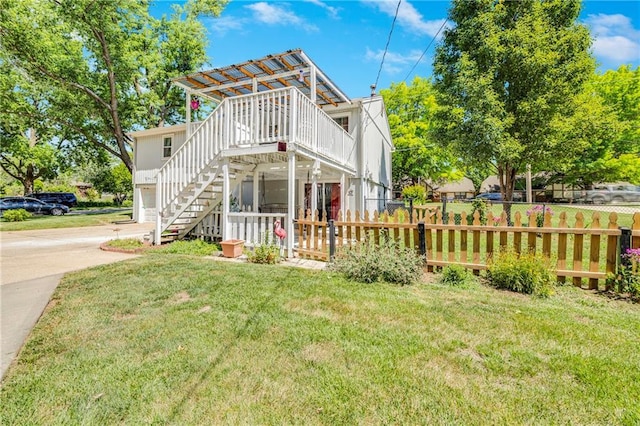300 NE R D Mize Rd, Blue Springs, MO 64014 - back of property with driveway, stairs, and a deck