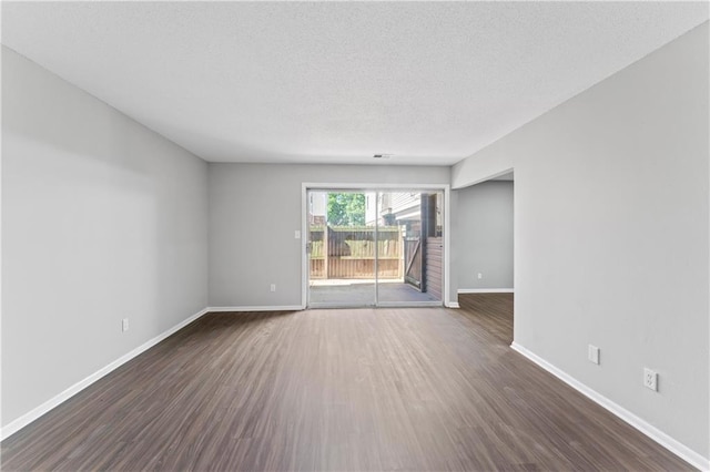 10240 W 96th Ter Unit B, Overland Park, KS 66212 - empty room featuring dark wood finished floors and a textured ceiling