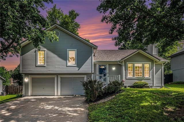 10512 Shelton Ave, Edwardsville, KS 66111 - tri-level home featuring an attached garage and driveway