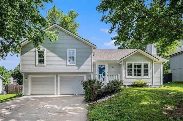 10512 Shelton Ave, Edwardsville, KS 66111 - split level home with driveway and an attached garage