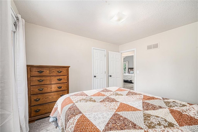 10512 Shelton Ave, Edwardsville, KS 66111 - bedroom with light carpet and a textured ceiling