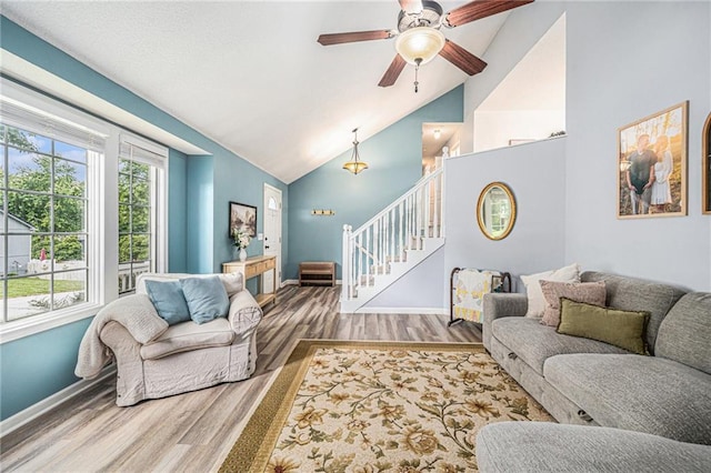 10512 Shelton Ave, Edwardsville, KS 66111 - living area with wood finished floors, stairs, high vaulted ceiling, and a ceiling fan