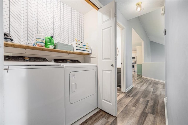 10512 Shelton Ave, Edwardsville, KS 66111 - laundry room with washer and clothes dryer and wood finished floors