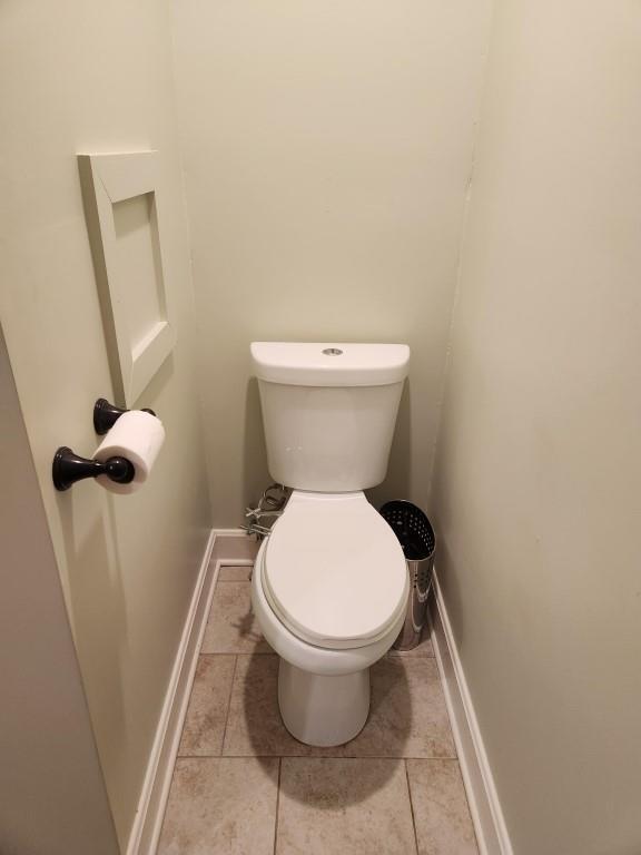520 S Russell St, Odessa, MO 64076 - bathroom featuring tile patterned flooring