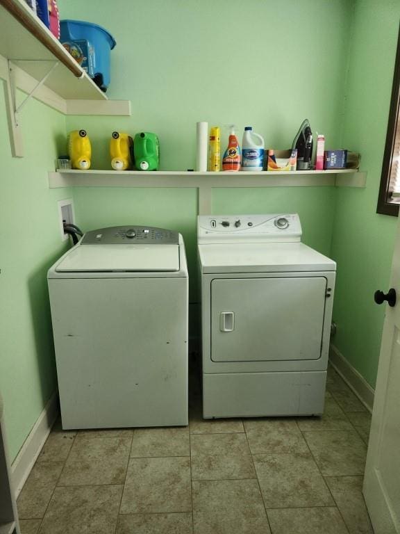 520 S Russell St, Odessa, MO 64076 - washroom with washer and dryer and light tile patterned floors