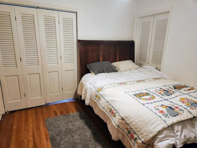 520 S Russell St, Odessa, MO 64076 - bedroom with a closet, wood finished floors, and wainscoting