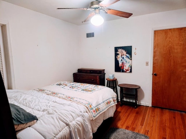 520 S Russell St, Odessa, MO 64076 - bedroom featuring wood finished floors and ceiling fan