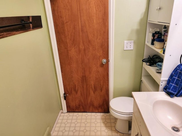 520 S Russell St, Odessa, MO 64076 - bathroom featuring vanity and toilet