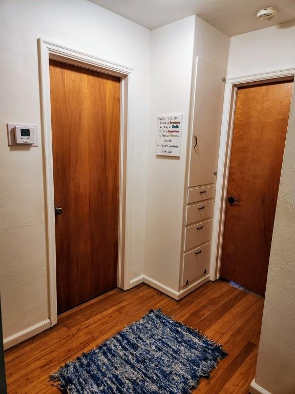 520 S Russell St, Odessa, MO 64076 - foyer with wood finished floors and baseboards