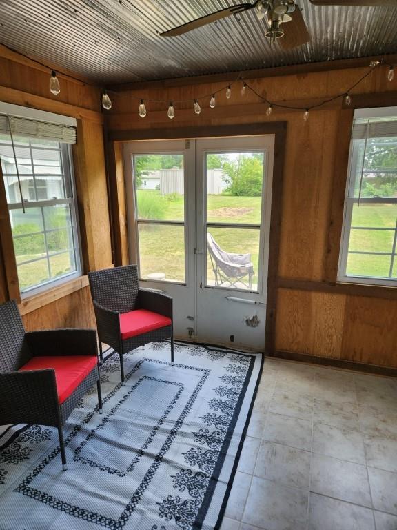 520 S Russell St, Odessa, MO 64076 - sunroom with plenty of natural light and french doors
