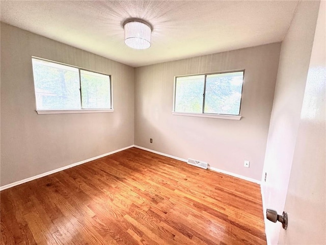 1012 NW A St, Blue Springs, MO 64015 - empty room with wood finished floors and baseboards