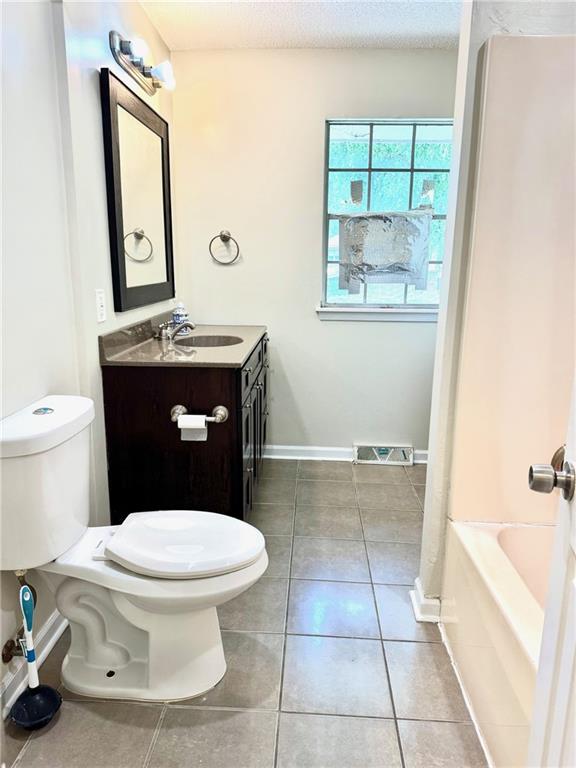 1012 NW A St, Blue Springs, MO 64015 - full bath with vanity and tile patterned flooring