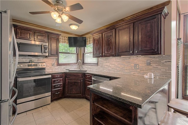 8300 W 148th St, Overland Park, KS 66223 - kitchen with appliances with stainless steel finishes, dark brown cabinets, a ceiling fan, light tile patterned flooring, and crown molding