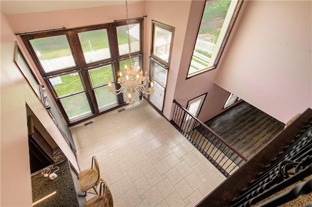 8300 W 148th St, Overland Park, KS 66223 - foyer with a chandelier, healthy amount of natural light, and tile patterned flooring