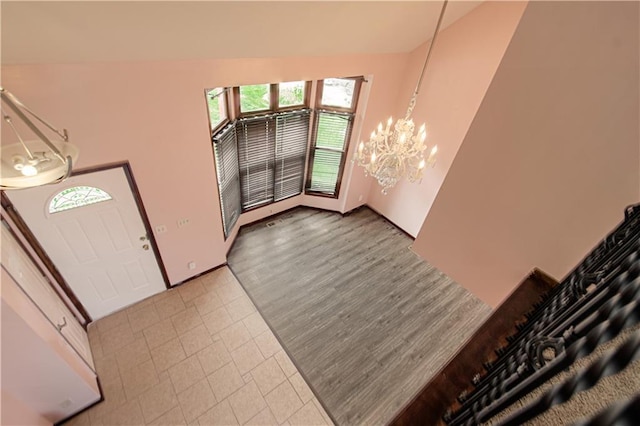 8300 W 148th St, Overland Park, KS 66223 - foyer entrance with a chandelier and tile patterned flooring