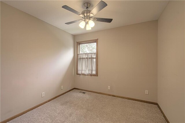 8300 W 148th St, Overland Park, KS 66223 - spare room with light carpet and ceiling fan