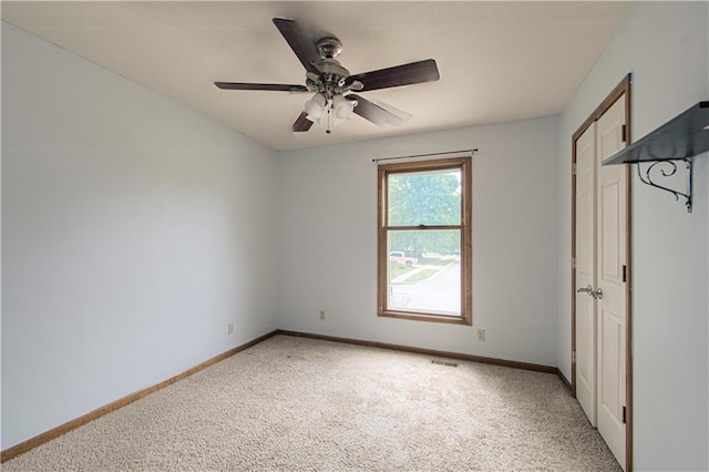 8300 W 148th St, Overland Park, KS 66223 - unfurnished bedroom with light carpet and a ceiling fan