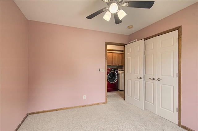 8300 W 148th St, Overland Park, KS 66223 - unfurnished bedroom featuring light carpet, a closet, washing machine and clothes dryer, and a ceiling fan