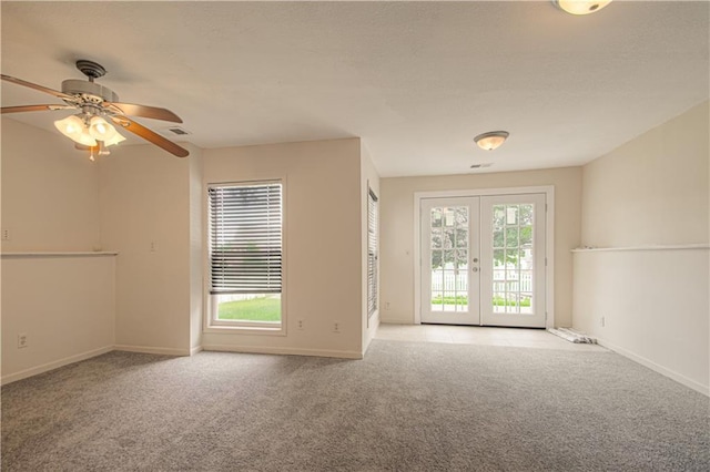 8300 W 148th St, Overland Park, KS 66223 - unfurnished room featuring french doors, carpet floors, healthy amount of natural light, and a ceiling fan