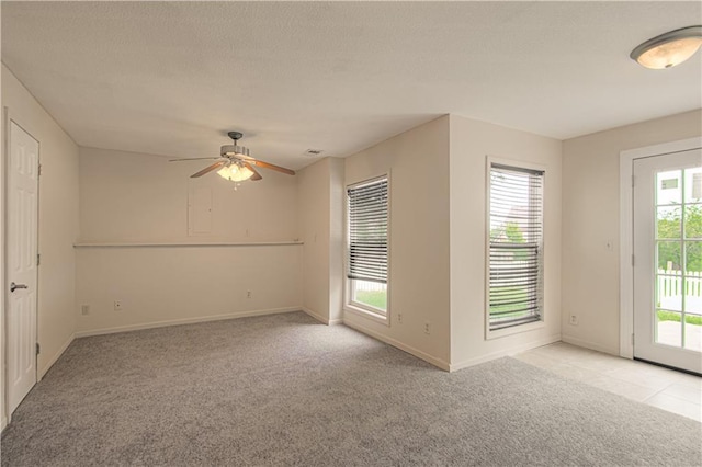 8300 W 148th St, Overland Park, KS 66223 - spare room with light carpet, ceiling fan, and a textured ceiling