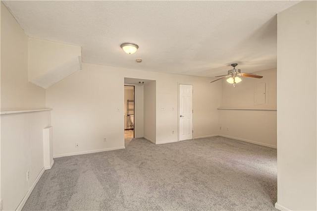 8300 W 148th St, Overland Park, KS 66223 - unfurnished living room with ceiling fan, carpet, and a textured ceiling