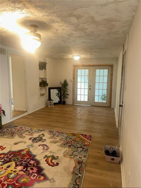300 W Sea Ave, Independence, MO 64050 - living area with wood finished floors and french doors