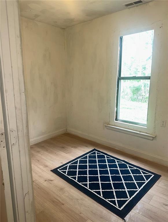 300 W Sea Ave, Independence, MO 64050 - empty room featuring baseboards and wood finished floors