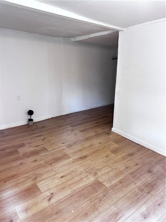 300 W Sea Ave, Independence, MO 64050 - unfurnished room with wood finished floors and baseboards