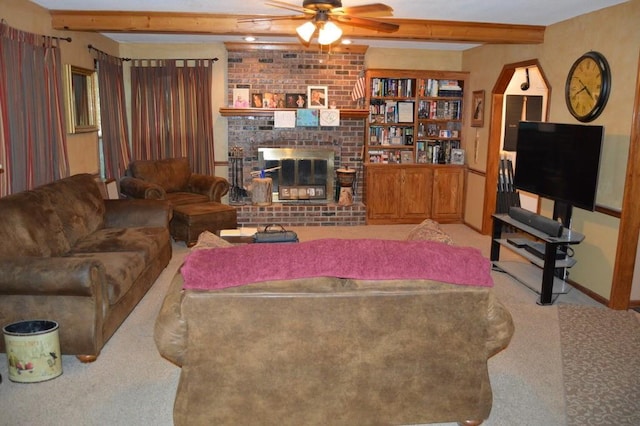 13655 S Sycamore St, Olathe, KS 66062 - living room with carpet, ceiling fan, beam ceiling, and a brick fireplace