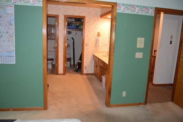 13655 S Sycamore St, Olathe, KS 66062 - hallway with light carpet and wallpapered walls