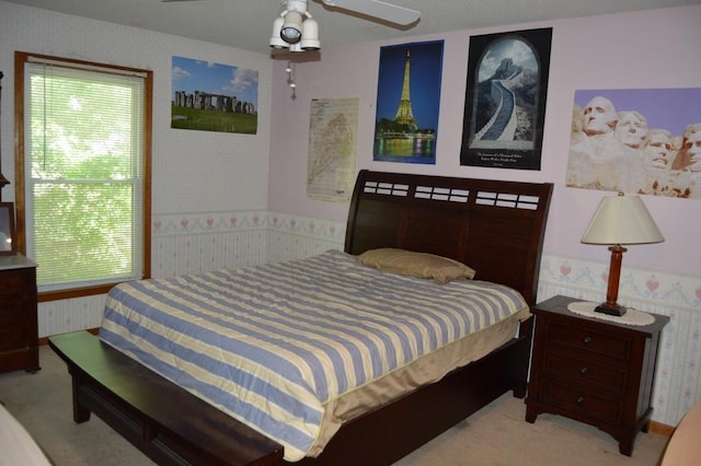 13655 S Sycamore St, Olathe, KS 66062 - carpeted bedroom with wallpapered walls, multiple windows, and a wainscoted wall