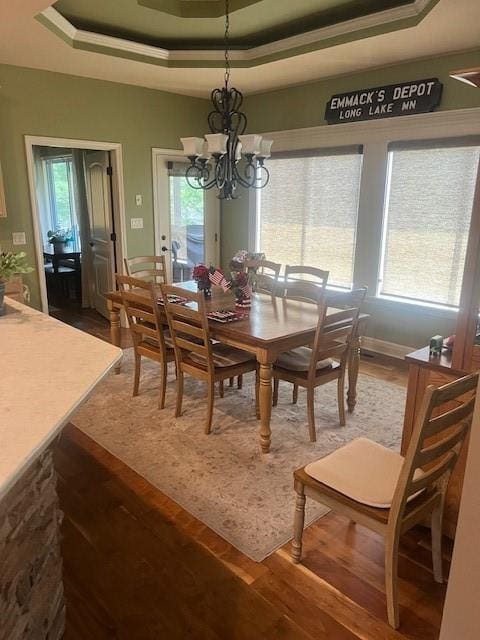 19706 E 20th St N, Independence, MO 64058 - dining area featuring a raised ceiling, a chandelier, wood finished floors, and crown molding