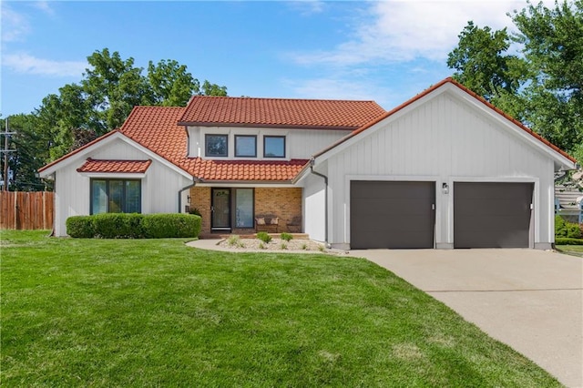 5490 W 85th Ter, Prairie Village, KS 66207 - mediterranean / spanish home with a tile roof, an attached garage, and concrete driveway