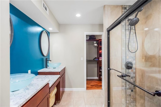 5490 W 85th Ter, Prairie Village, KS 66207 - full bath featuring two vanities, a shower stall, tile patterned floors, and recessed lighting