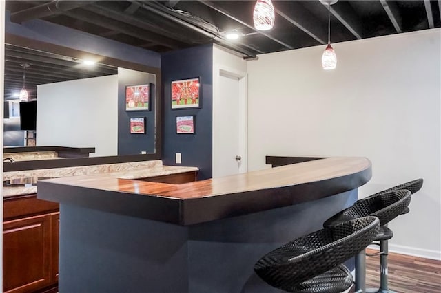 5490 W 85th Ter, Prairie Village, KS 66207 - indoor dry bar with dark wood-style flooring and hanging light fixtures