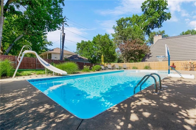 5490 W 85th Ter, Prairie Village, KS 66207 - view of pool featuring a water slide, a fenced backyard, and a patio area