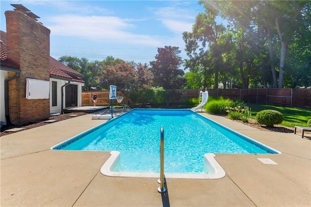 5490 W 85th Ter, Prairie Village, KS 66207 - view of swimming pool with a water slide, a patio, and a fenced backyard