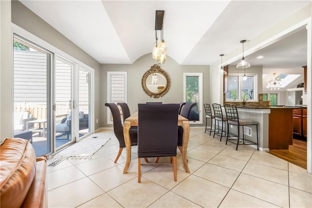 5490 W 85th Ter, Prairie Village, KS 66207 - dining space featuring light tile patterned flooring and vaulted ceiling