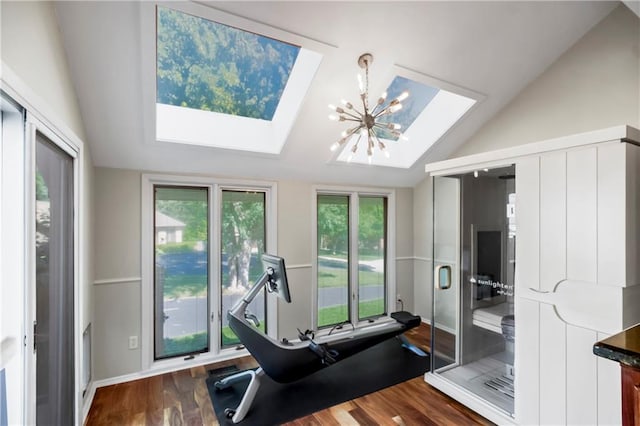 5490 W 85th Ter, Prairie Village, KS 66207 - workout area featuring a skylight, vaulted ceiling, healthy amount of natural light, dark wood finished floors, and a chandelier