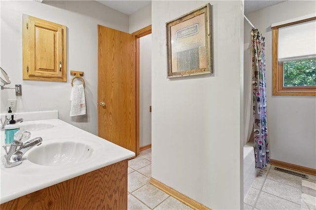 1684 Quarry Rd, Bates City, MO 64011 - full bathroom with tile patterned floors, double vanity, and shower / tub combo